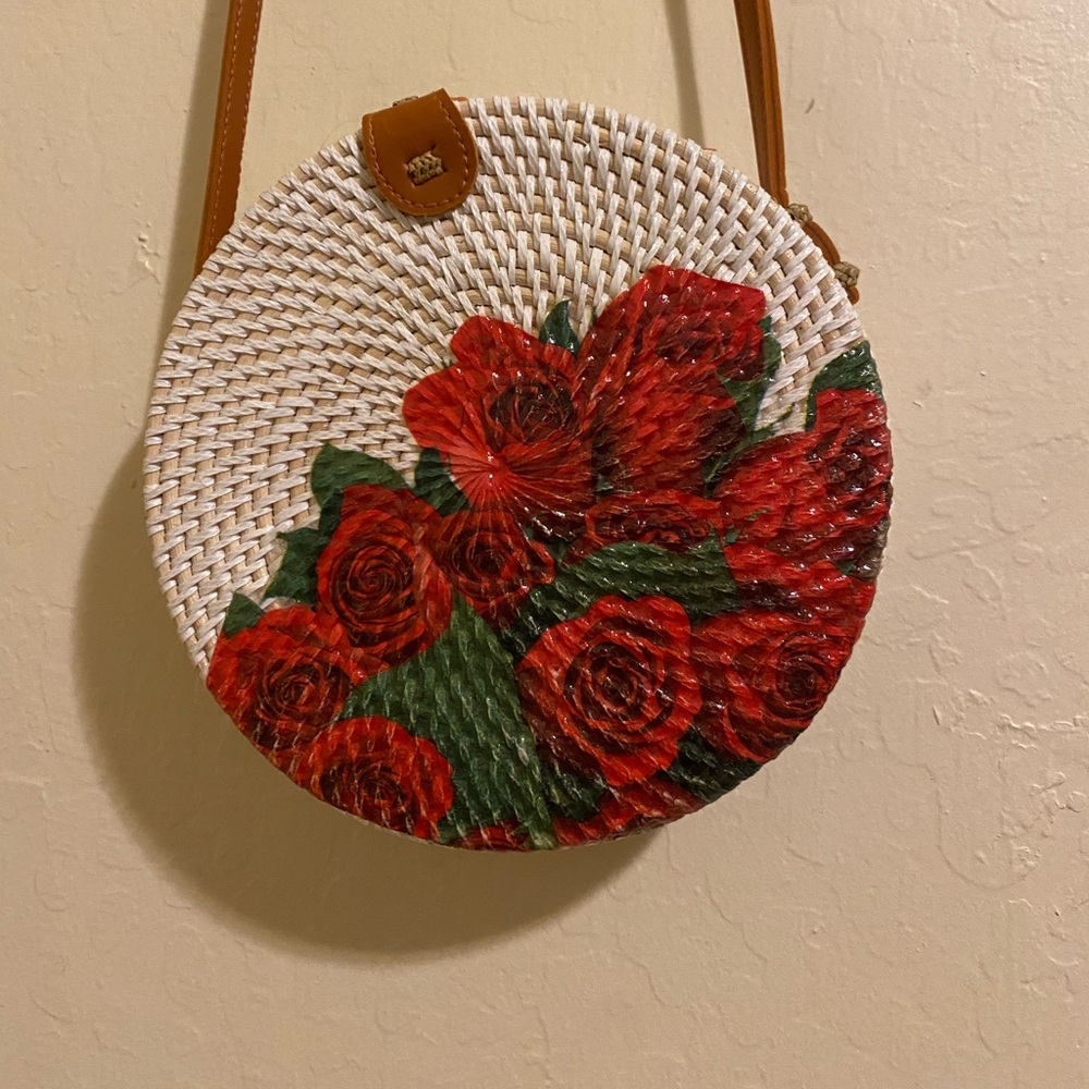 Handwoven circle rattan bag with a Rose Design